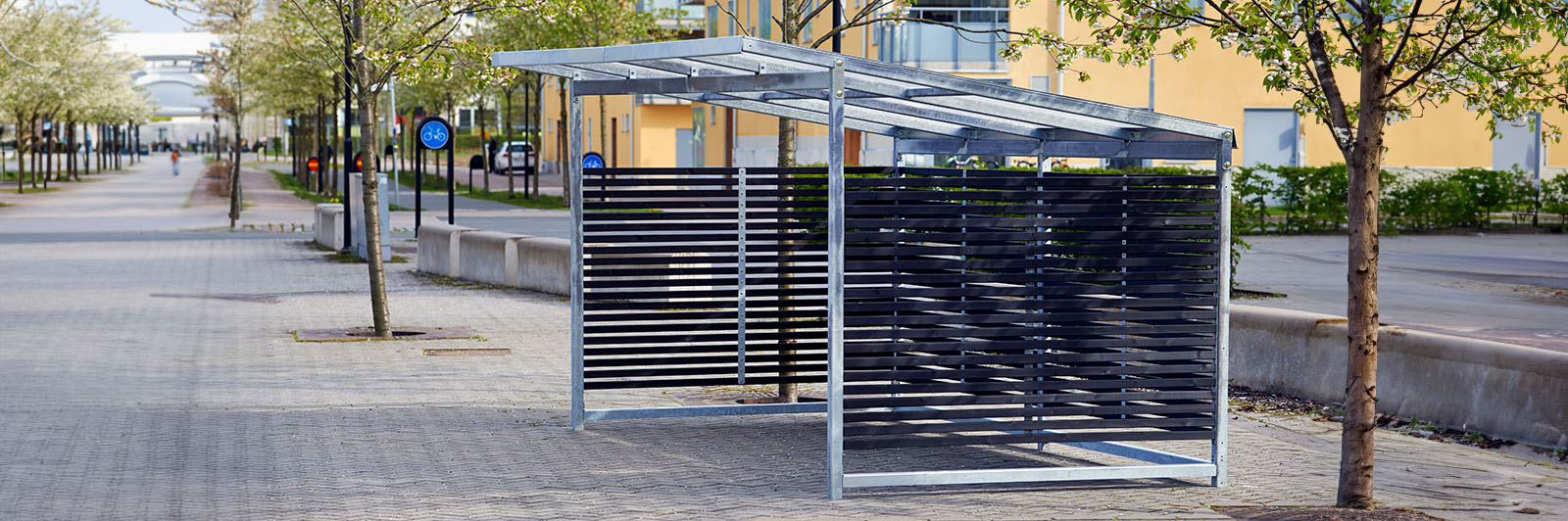 Large bicycle garage in an outdoor street environment.